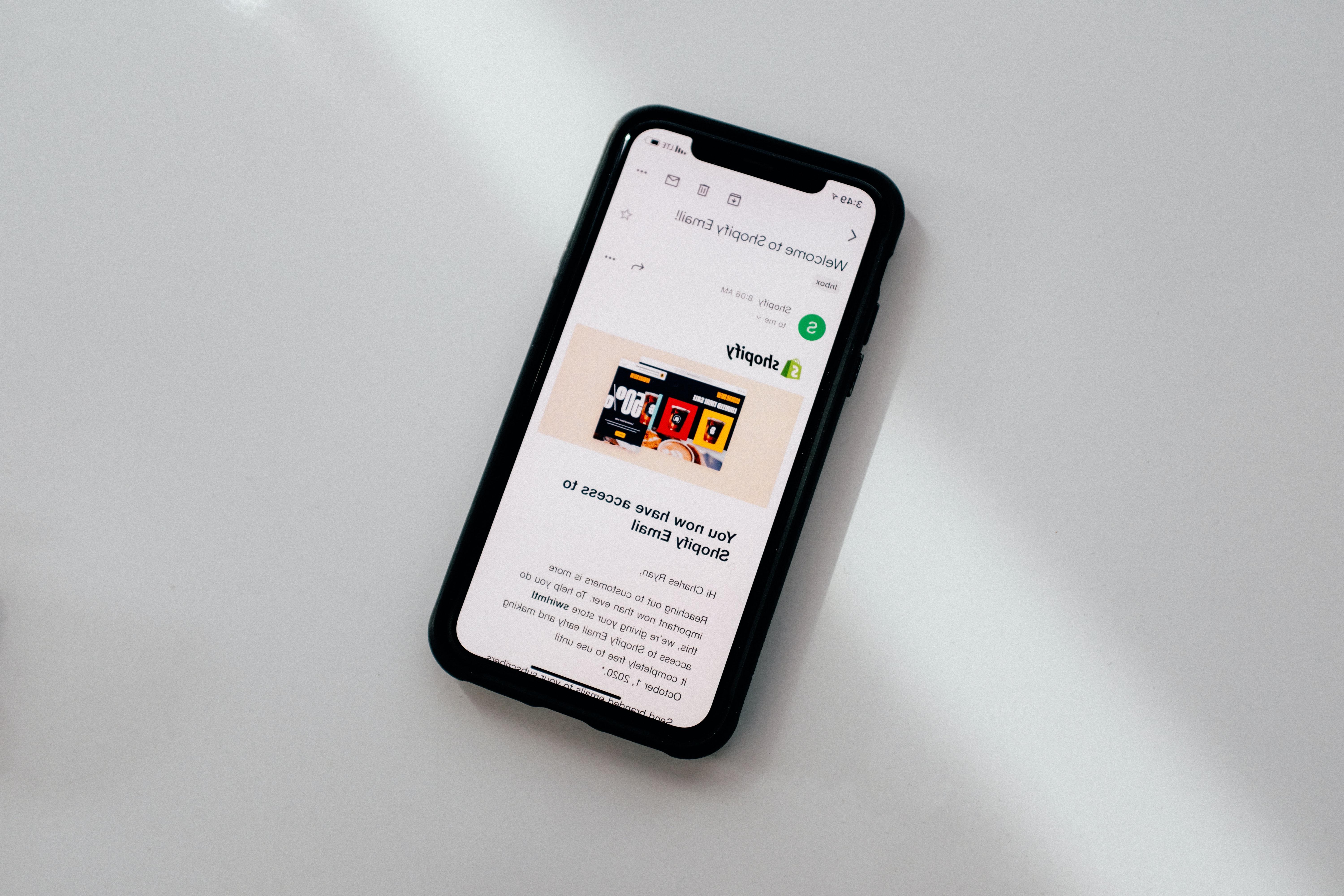 An iphone showing an email from Shopify